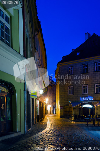 Image of narrow alley with lanterns in Prague at night