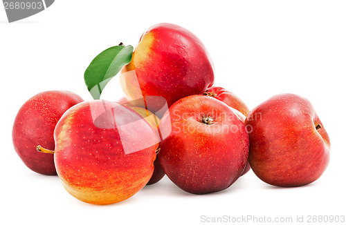 Image of Red Apples with green leaf on white