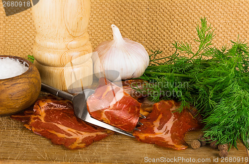 Image of simple farm bacon, stranded on a fork