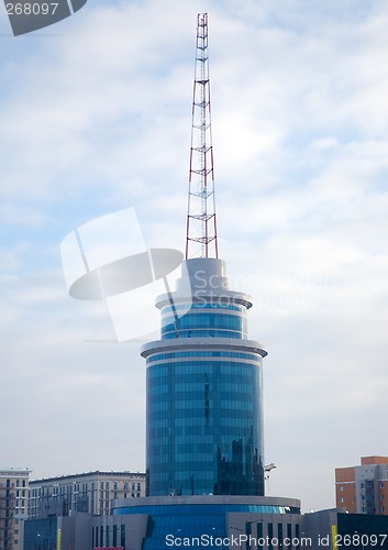 Image of Modern building and communicate mast.