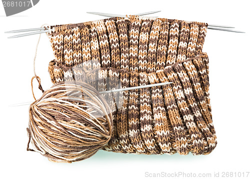 Image of knitting pattern with a ball of yarn and needles