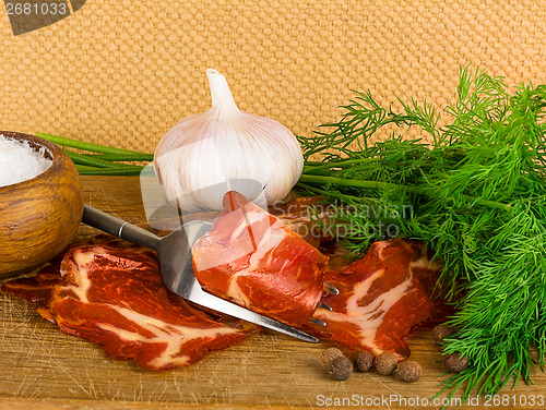 Image of simple farm bacon, stranded on a fork