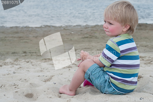 Image of Little boy in striped t-hirt