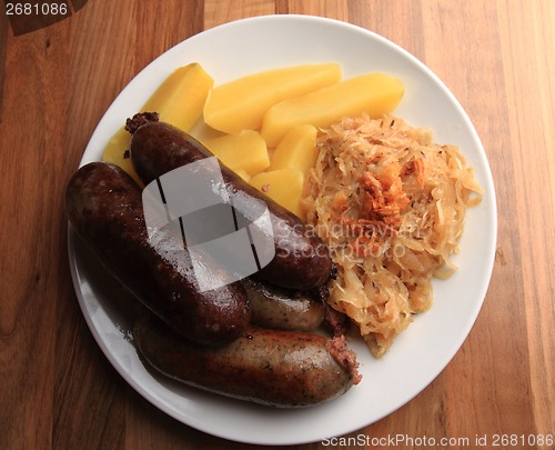 Image of czech food - black and white pudding with potatoes and sauerkrau