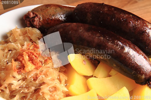 Image of czech food - black and white pudding with potatoes and sauerkrau