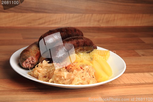 Image of czech food - black and white pudding with potatoes and sauerkrau
