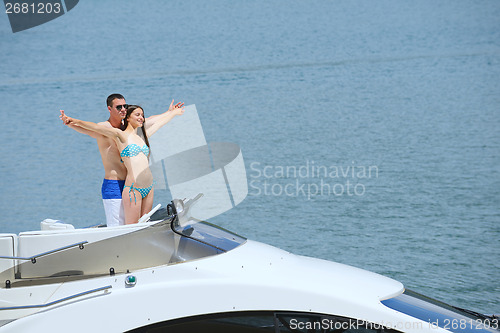 Image of young couple on yacht