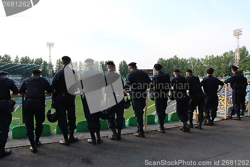 Image of policemen standing guard over order in the stadium