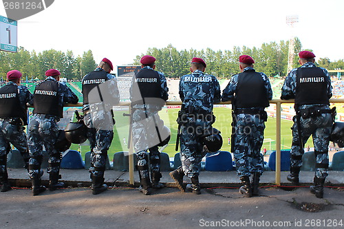 Image of policemen standing guard over order in the stadium