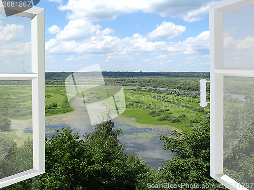 Image of opened window to the summer landscape