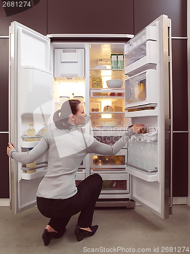 Image of woman looking for something to eat