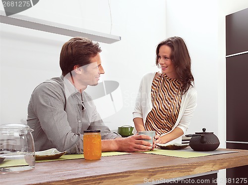 Image of couple in the kitchen aa