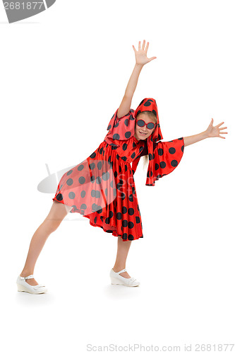 Image of teen girl dancing in a red polka-dot dress