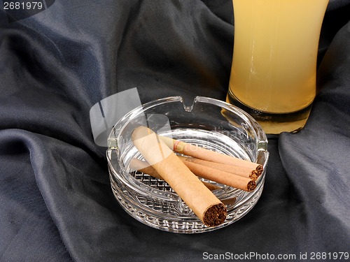 Image of cuban cigar and beer cup