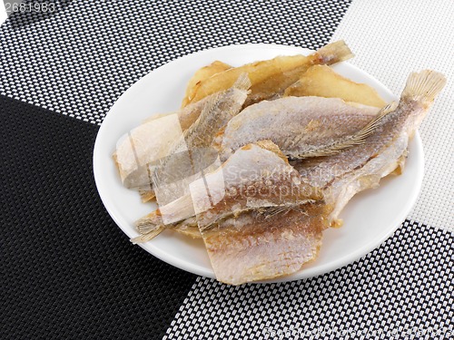 Image of Dried fishes on white plate