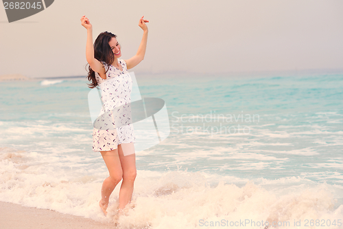Image of Happy Beautiful Woman Enjoying Summer Vacation