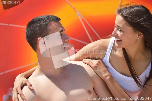 Image of happy couple have fun on the beach