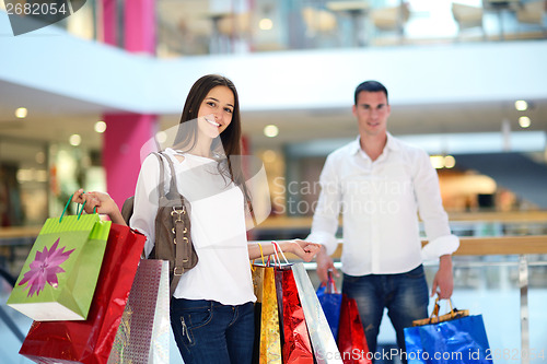 Image of happy young couple in shopping