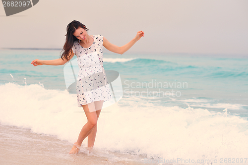 Image of Happy Beautiful Woman Enjoying Summer Vacation