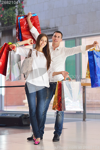 Image of happy young couple in shopping