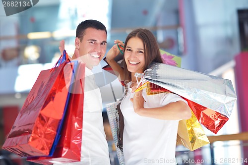 Image of happy young couple in shopping