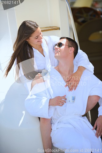 Image of young couple on yacht