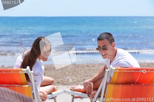 Image of happy couple have fun on the beach