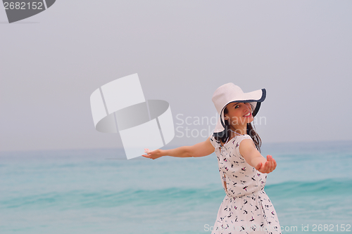 Image of Happy Beautiful Woman Enjoying Summer Vacation