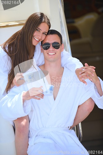 Image of young couple on yacht