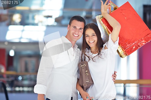 Image of happy young couple in shopping