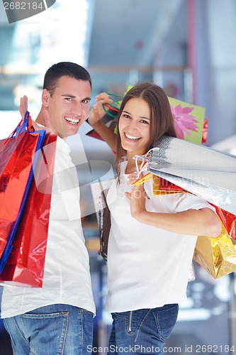 Image of happy young couple in shopping