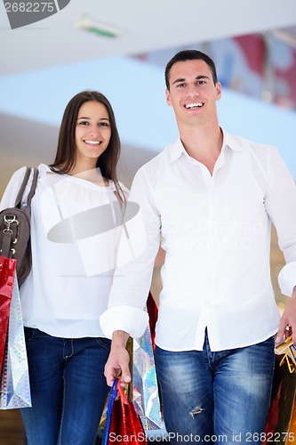 Image of happy young couple in shopping