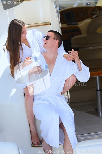 Image of young couple on yacht