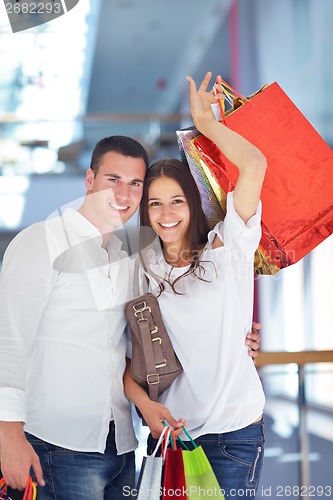 Image of happy young couple in shopping