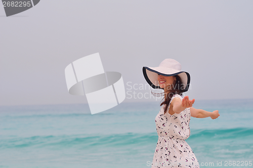 Image of Happy Beautiful Woman Enjoying Summer Vacation