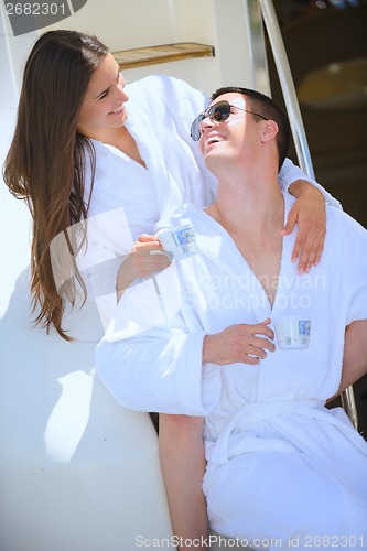 Image of young couple on yacht