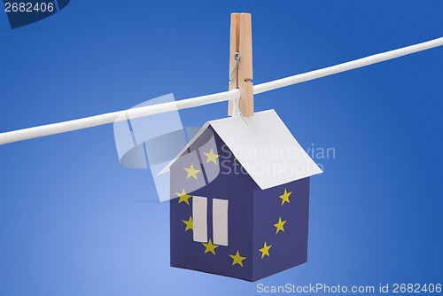 Image of European Union flag printed on paper house