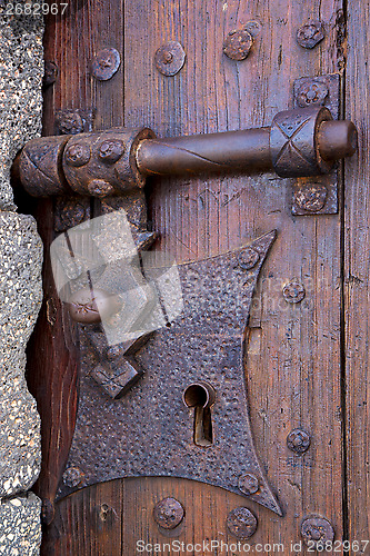 Image of castle lock spain knocker   abstract door wood in the red brown 