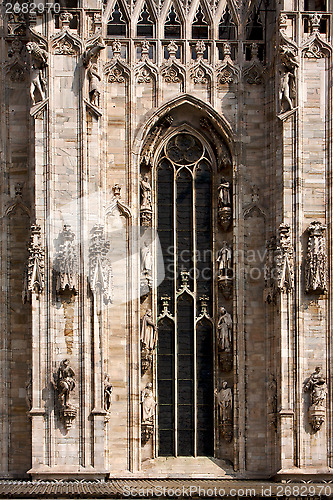 Image of italy church  rose window  the front of the duomo  and column
