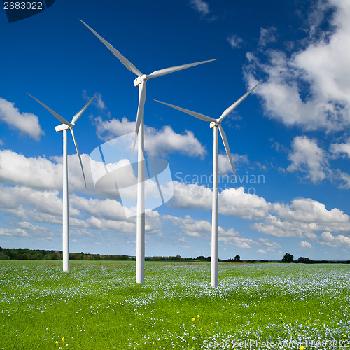 Image of Wind generator turbine on spring landscape