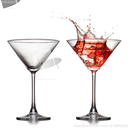 Image of empty an? full martini glass with red cocktail with splash isol