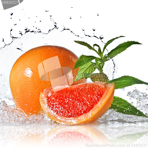 Image of Water splash on grapefruit with mint isolated on white