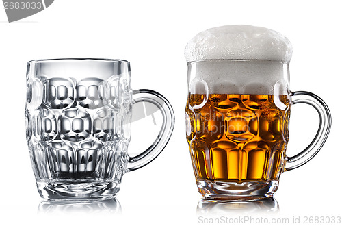 Image of Empty and full beer in glass isolated on white