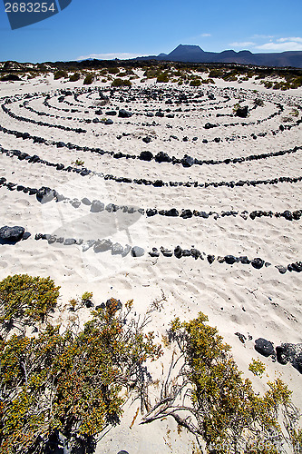 Image of spain  hill white  beach    black rocks in the   lanzarote 