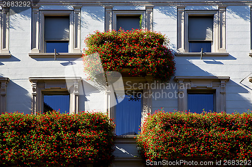 Image of  wall and flower terrace in the   centre   of city lugano Switze