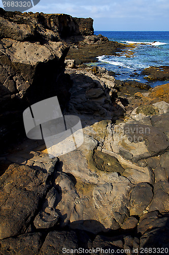 Image of beach  light  water  in lanzarote  isle foam rock      sky cloud