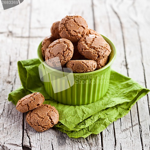 Image of meringue almond cookies in a green bowl