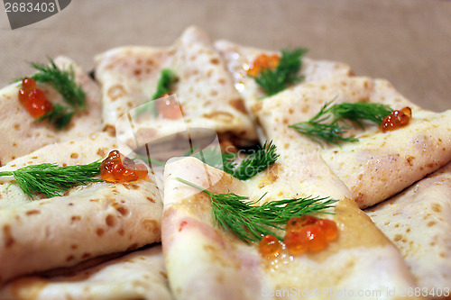 Image of pancakes with red caviar and fennel