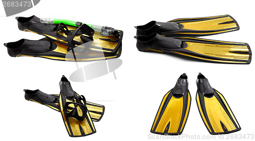 Image of Set of yellow swim fins, mask and snorkel for diving