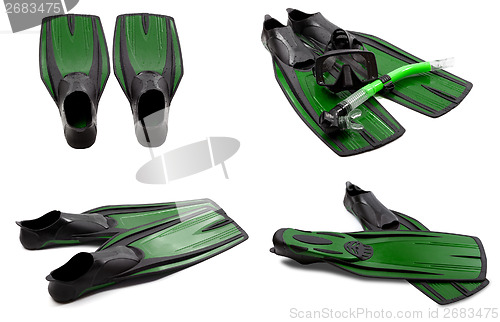 Image of Set of green swim fins, mask, snorkel for diving with water drop